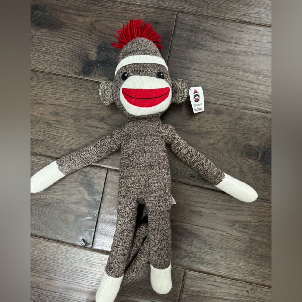 New w tags sock monkey.